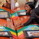 A woman lays on the coffin of her loved one during a memorial service for the Ethiopian passengers and crew who died on Flight 302